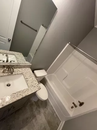 Sparkling bathroom vanity and mirror after deep cleaning