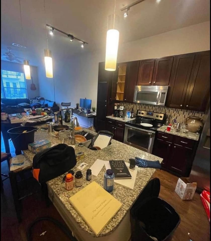 Kitchen before cleaning, cluttered counters and dishes